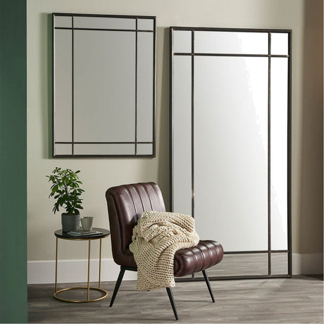 Antique Bronze Rectangular Floor Mirror, 100 x 200cm, leaning against a wall in a living room beside a smaller matching mirror, leather armchair, and round side table.