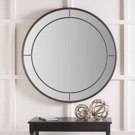 Round wall mirror in antique bronze, 100 x 100cm, with a slim double-ring metal frame, hung above a black console table styled with silver decorative spheres.