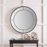 Round wall mirror in antique bronze finish, 80 x 80cm, with a slim metal frame and cross-bar detailing, mounted above a black console table in a hallway setting.