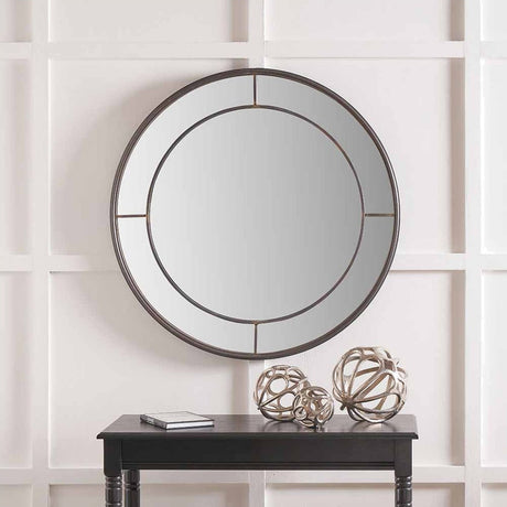 Round wall mirror in antique bronze finish, 80 x 80cm, with a slim metal frame and cross-bar detailing, mounted above a black console table in a hallway setting.