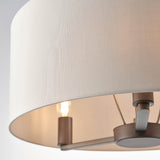 Close-up of the Endon Bexley 3 light pendant showing the marble-effect faux silk shade interior with dark antique bronze fittings and an E14 lamp.