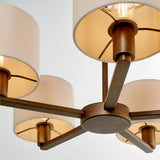 Close-up of Endon Bexley 5 Light Pendant in bronze, showing curved arms from a central plate holding marble-effect faux silk drum shades.