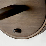 Close-up of the Endon Bexley wall light in bronze, showing the brushed dark antique arm base and small on/off toggle switch on the round mount.