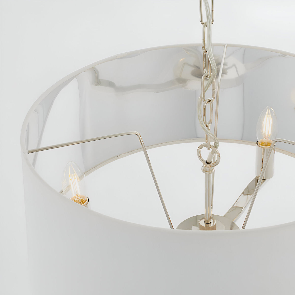 Close-up of Endon Brendale 3 light pendant showing nickel metalwork, three E14 lamps and white faux silk shade with metallic silver lining.