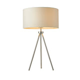 Cranwell tripod table lamp with chrome splayed legs and a wide cream fabric drum shade, shown on a plain white background.