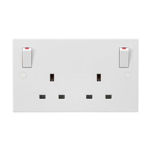 The product is a 13A 2 Gang DP Switched Socket with Twin Earths and Outboard Rockers, featuring a white finish with two double pole switches, each with a red indicator. It includes standard three-pin UK plug holes and boasts an anti-microbial finish. Its minimalist square edge design ensures it is both modern and functional.