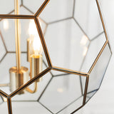 Close-up of Endon Carldon 3 Light Pendant showing hexagonal clear glass panels edged in antique brass with lit E14 candle bulbs on brass holders.