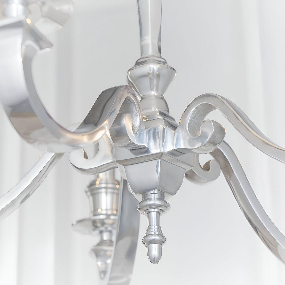 Close-up of the Endon Brambourne 5 Light Pendant in polished aluminium, showing the central column, scrolled arms and decorative finial.