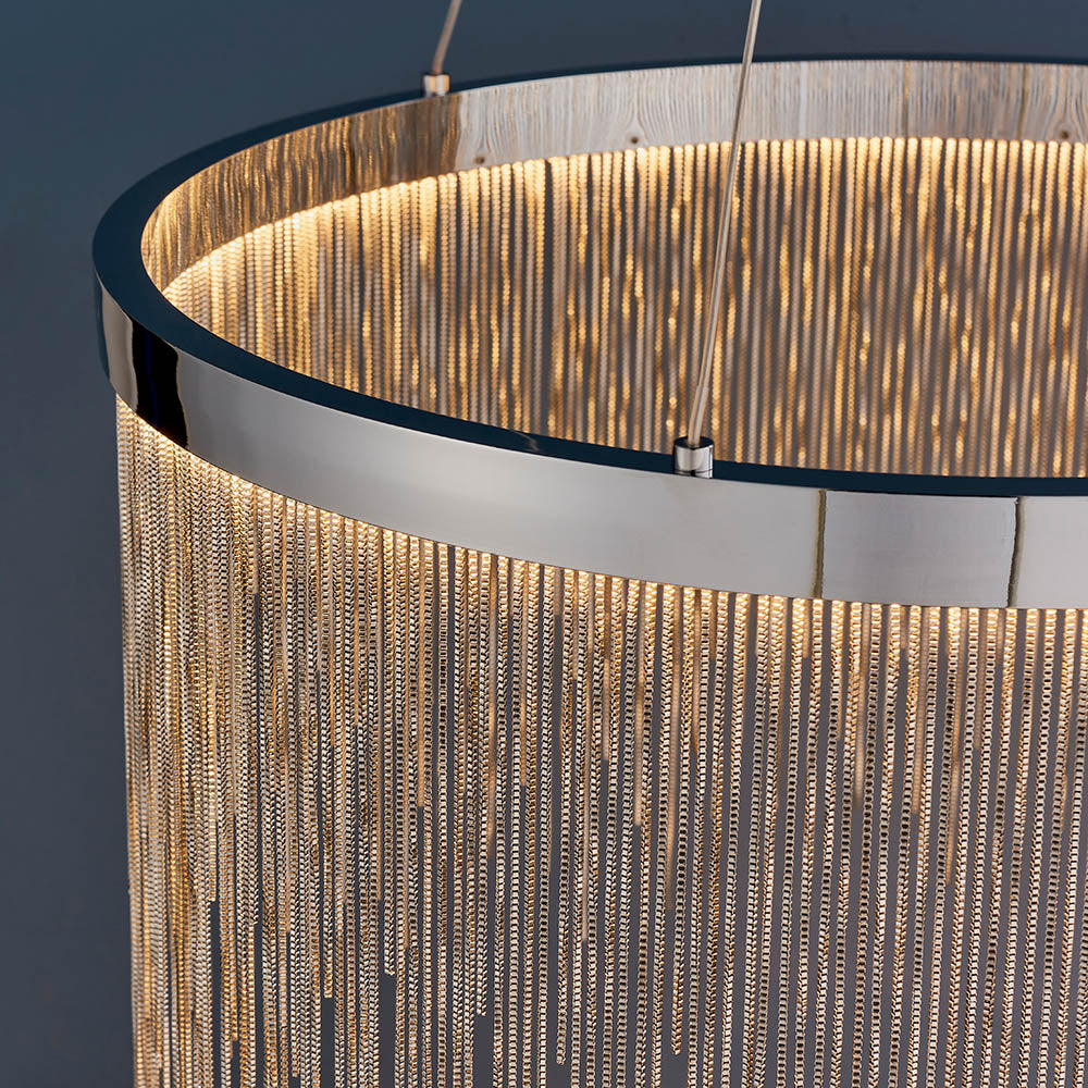 Danestead Pendant in polished chrome, close-up of the circular LED ring behind cascading fine chains that catch and scatter the light.