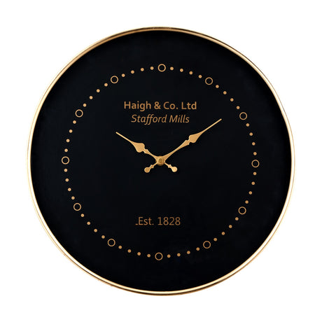 Round black-faced wall clock, 38cm, with antique brass frame and hands, gold dot markers, and printed text on a plain white background.