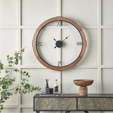Vermont Light Walnut Wood Veneer Round Wall Clock, 80cm, with black Roman numerals and hands, shown on a panelled wall above a console table.