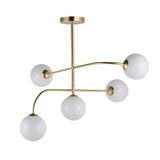 Endon Sinclair 5 light semi-flush ceiling light with brushed brass arms and white opal glass globes on a plain background.