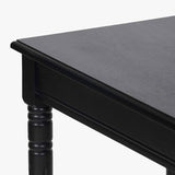 Close-up of the Heritage Black Pine Console Table, 80cm, showing the black-finished wood corner, turned leg detail, and moulded edge on a plain white background.