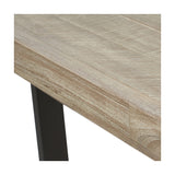 Close-up of the Marca dining table's sand wash acacia wood tabletop edge with visible grain, paired with a black iron angled leg.