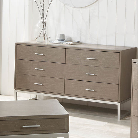 Ambroso Grey Wash Mango 6 drawer unit with silver iron base, shown in a bedroom with three drawers per side and brushed metal handles.