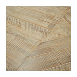 Close-up of the Marca Sand Wash Acacia dining table top, showing chevron-patterned wood panels with brushed texture in natural beige tones.