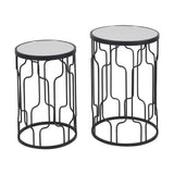 Caprisse set of 2 side tables in graphite iron with round mirrored glass tops and geometric wave-patterned open frames, shown on a plain white background.