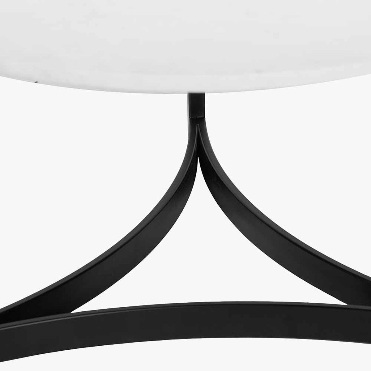 Close-up of the Hendrick coffee table's black iron tripod base with curved legs supporting a white marble tabletop, shown on a plain white background.