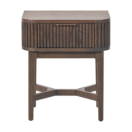 Raie Dark Brown Ribbed Oak & Pine 1 Drawer Unit, a rounded bedside chest with fluted drawer front, brass bar handle, and cross-braced wooden legs, shown on a plain white background.