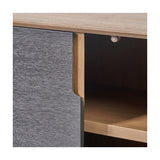 Close-up of the Gio Black & Acacia 4 Door Sideboard, showing a textured black door front against a natural wood frame with an open shelf compartment and brass-toned hinge.