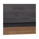 Close-up of the Gio Black & Acacia Dining Table's edge, showing a black wood-grain tabletop set above a natural acacia wood frame.