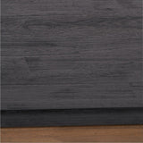 Close-up of the Gio Black & Acacia Dining Table showing the black wood-grain tabletop edge with visible brush texture above a natural acacia base.
