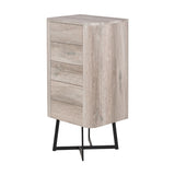 Ukiah tall chest of drawers in grey oak veneer with five drawers, rounded corners, and black metal cross-frame legs, shown against a plain white background.