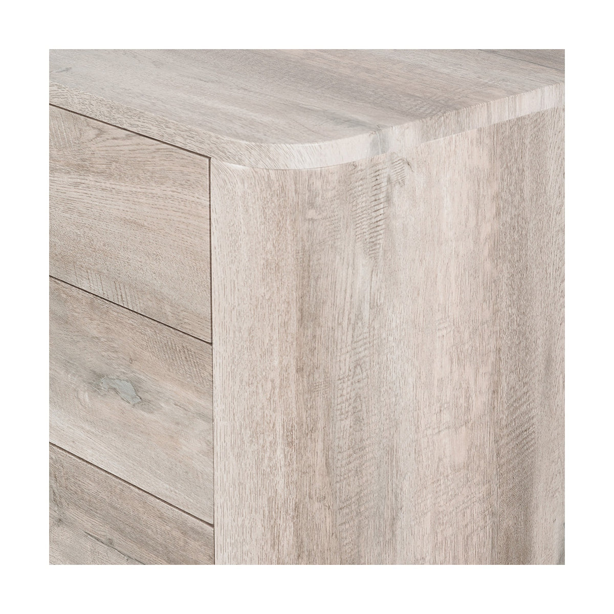 Close-up of the Ukiah Grey Oak Veneer chest of drawers, showing the wood-grain finish, rounded top corner, and drawer panel lines.