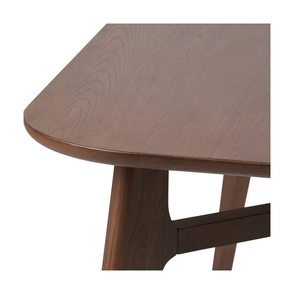 Close-up of the Elias Dark Ash Wood Retro Dining Table, showing the rounded tabletop edge, visible wood grain, and angled tapered leg joined by a horizontal stretcher.
