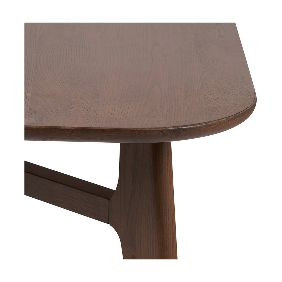 Close-up of the Elias Dark Ash Wood Retro Dining Table, showing the rounded tabletop edge, wood grain finish, and angled leg with cross rail joint, on a white background.