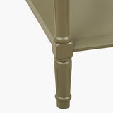 Close-up of the Heritage Olive Pine Large Console Table's turned wooden leg, showing carved detailing and a green painted finish against a plain white background.
