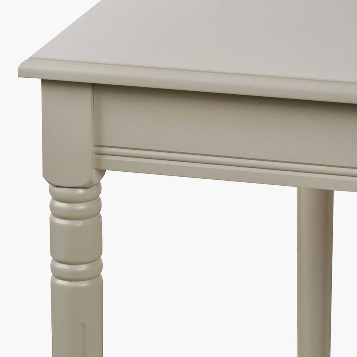 Close-up of the Heritage Putty Pine Large Console Table leg and frame, showing turned wood leg, moulded edge, and cream painted finish.