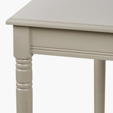 Close-up of the Heritage Putty Pine Large Console Table leg and frame, showing turned wood leg, moulded edge, and cream painted finish.