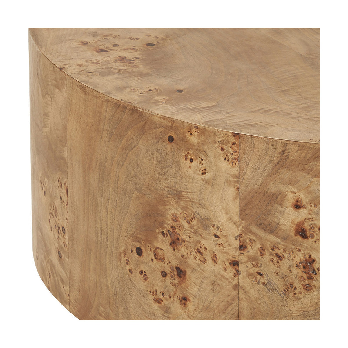 Close-up of the Newborough Burr Wood Effect Coffee Table showing rounded drum base and tabletop edge with detailed burr wood grain in warm tan tones, on a plain white background.