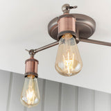 Brackley 3 Light Semi-Flush Ceiling Light in pewter and copper, angled arms with exposed E27 bulbs, mounted against a white ceiling.