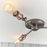 Brackley 3 Light Semi-Flush Ceiling Light in pewter and copper, angled metal arms with knurled copper E27 lamp holders, mounted on a white ceiling.