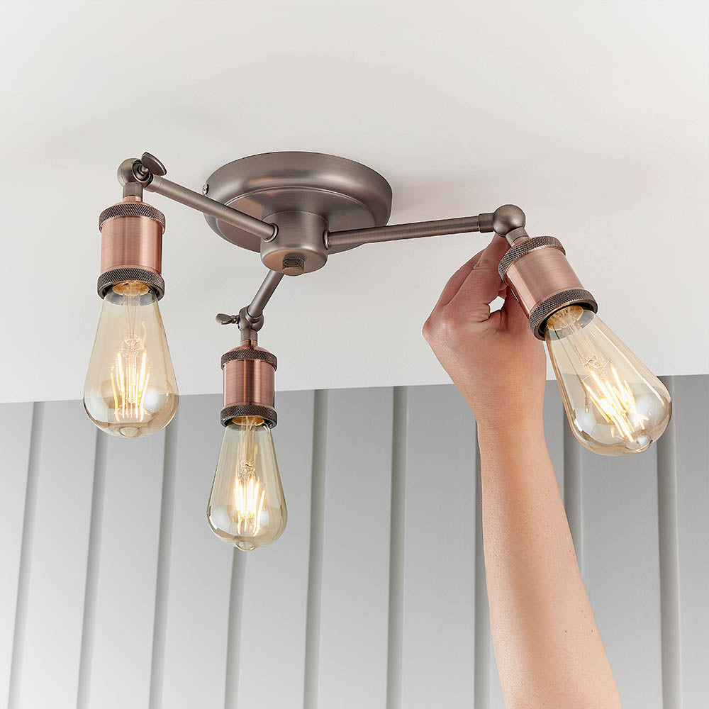 Brackley 3 Light Semi-Flush Ceiling Light in pewter/copper with three angled arms, copper holders, and exposed filament bulbs.