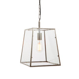 Brenton Lantern Pendant in nickel, tapered box-frame design with clear glass panels and exposed filament bulb, hung on a black chain against a white background.