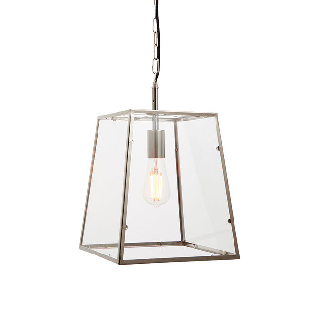 Brenton Lantern Pendant in nickel, tapered box-frame design with clear glass panels and exposed filament bulb, hung on a black chain against a white background.