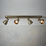 Endon Daneford 4 Light Spotlight in antique brass, ceiling-mounted bar with four adjustable steel heads angled outward, shown against a pale wall.