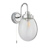 Endon Bramworth bathroom wall light in chrome with a curved arm, clear glass globe shade, E14 filament bulb and pull cord switch, on a white background.