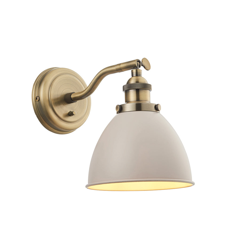 Endon Bramdale industrial wall light with adjustable antique brass knuckle arm, toggle switch and beige dome shade on a plain white background.