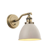 Endon Bramdale industrial wall light with adjustable antique brass knuckle arm, toggle switch and beige dome shade on a plain white background.