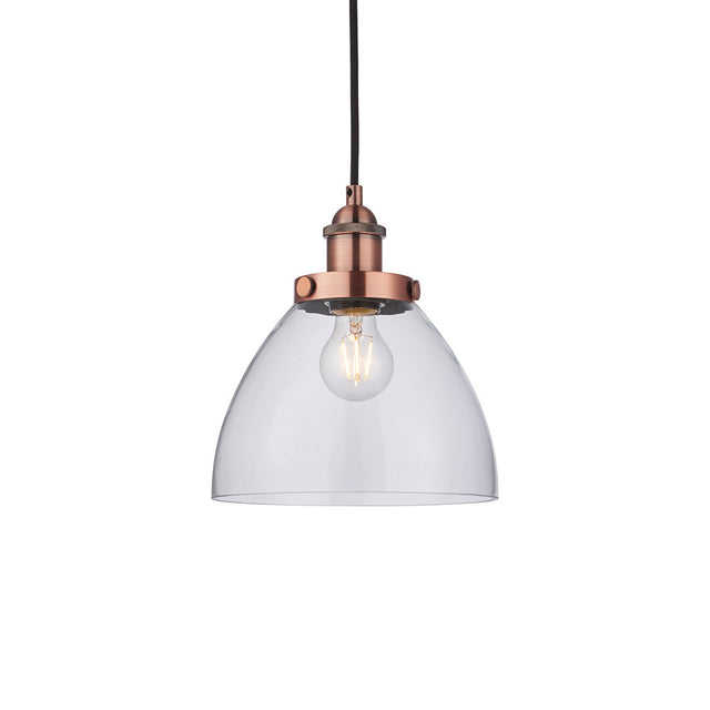 Endon Wentworth industrial pendant light with a clear glass dome shade, copper knurled lamp holder, exposed E27 filament bulb and black flex, on white.