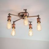 Endon Brackley 5 light semi-flush ceiling light in pewter and copper finish, with five angled arms holding exposed E27 filament bulbs.