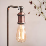 Brackley Table Lamp in copper and silver, close-up of adjustable knuckle joint and knurled E27 lamp holder with exposed bulb, industrial style.