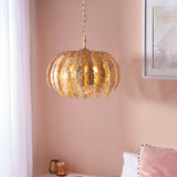 Endon Colette 3 light pendant in gold leaf with layered floral leaf shades, suspended by chain in a pink room beside a botanical print.