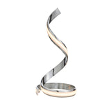 Endon Neve table lamp in polished chrome with a sculptural spiral form and integrated LED diffuser glowing warm white, shown on a plain background.