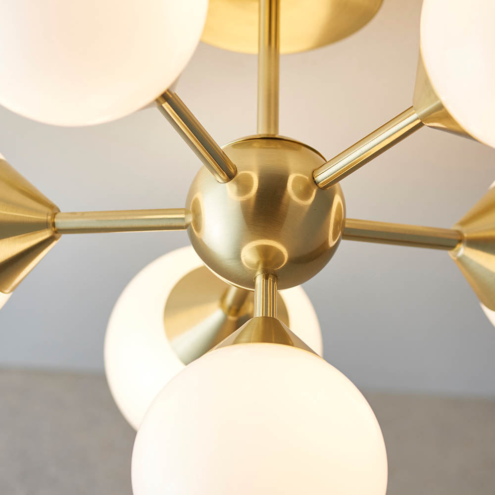 Fitzroy 6 Light Semi-Flush Ceiling Light in gold, close-up of brass sputnik-style arms and central sphere with opal glass globe shades.