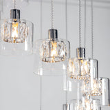 Marguerite 12-light pendant in polished chrome with faceted crystal shades in clear glass diffusers on adjustable cables.